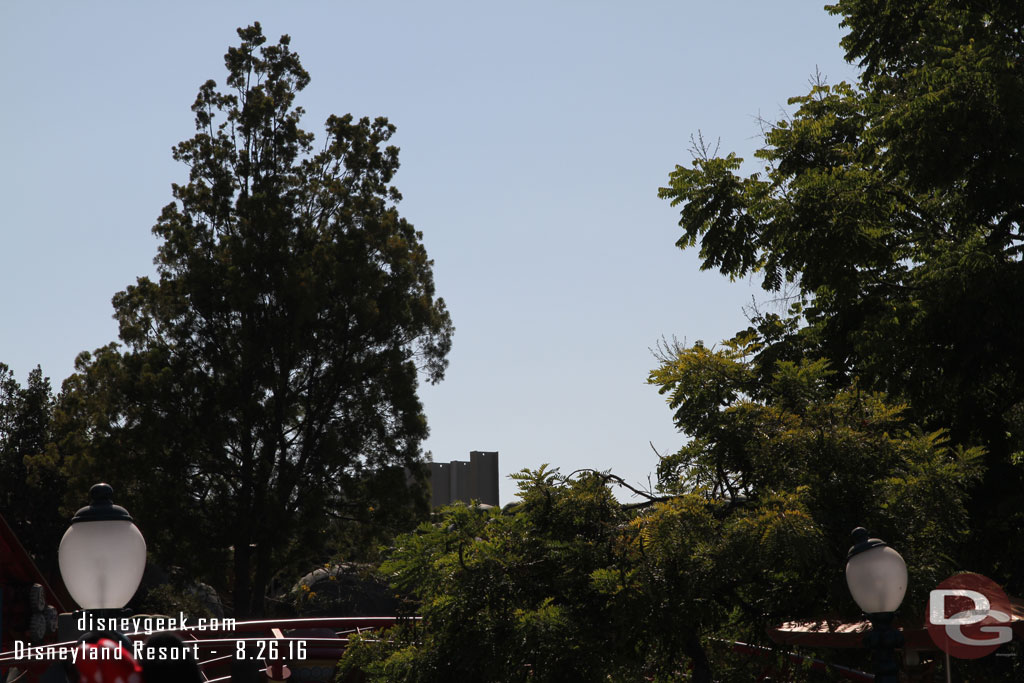 No visible change from this angle.. just the top of the beams sticking over the trees.