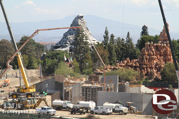 Looks like they have scaffolding going up in the marina area so they can put the roof on it that the train will travel across.