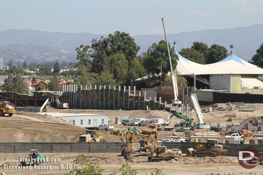 Portable office trailers have been brought in near the mound.  In the distance work on the retaining wall continues.