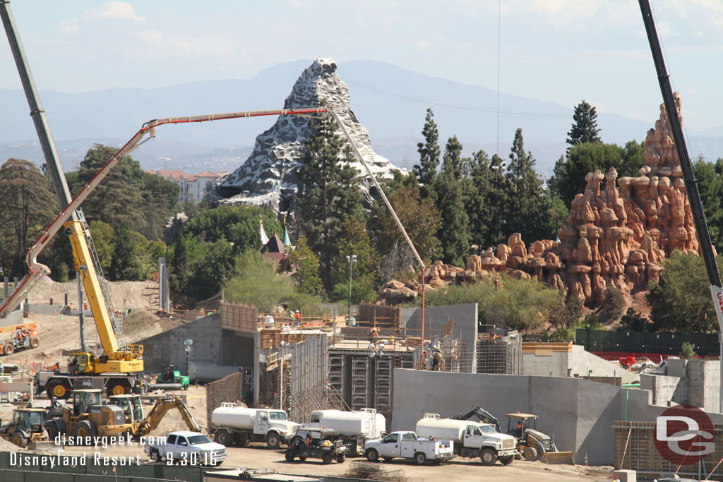 Looks like they have scaffolding going up in the marina area so they can put the roof on it that the train will travel across.