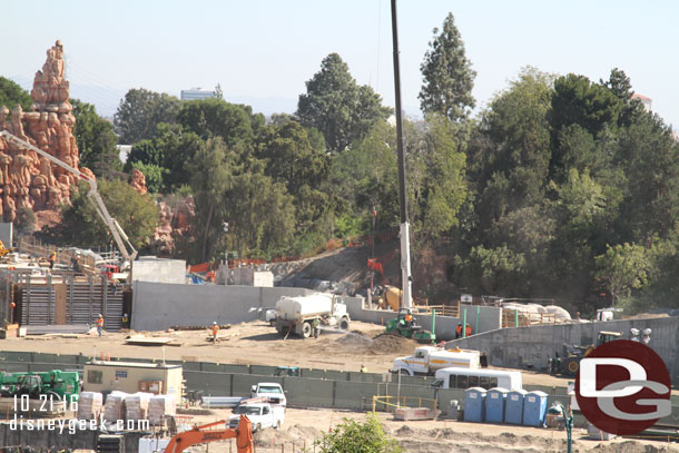 Dirt was being brought in and compacted against the new wall along the river path.