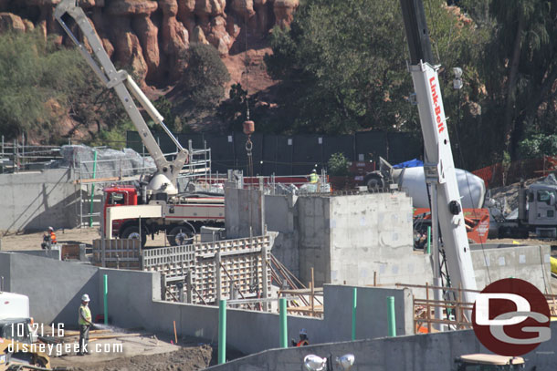 In the distance you can see wire mesh with scaffolding for rockwork (beyond the concrete pumping truck).