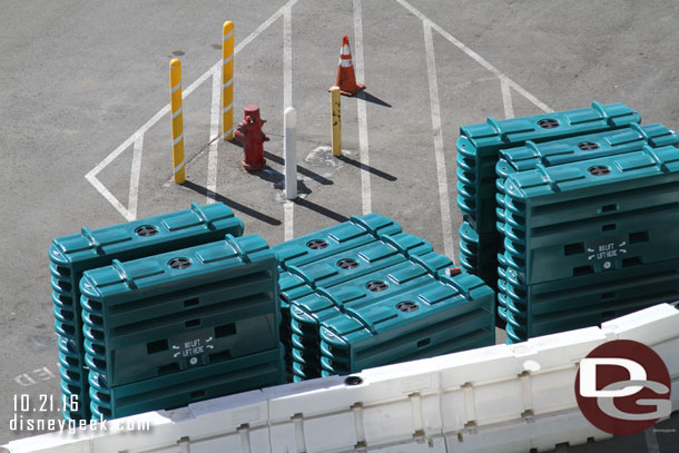 Temporary barriers staged in the lot.