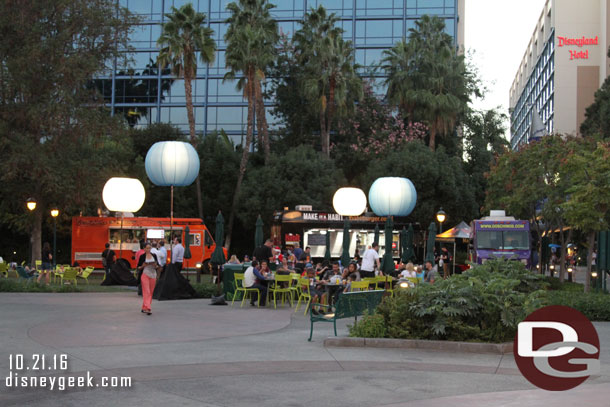 A seating area, lights and three trucks make up the event.