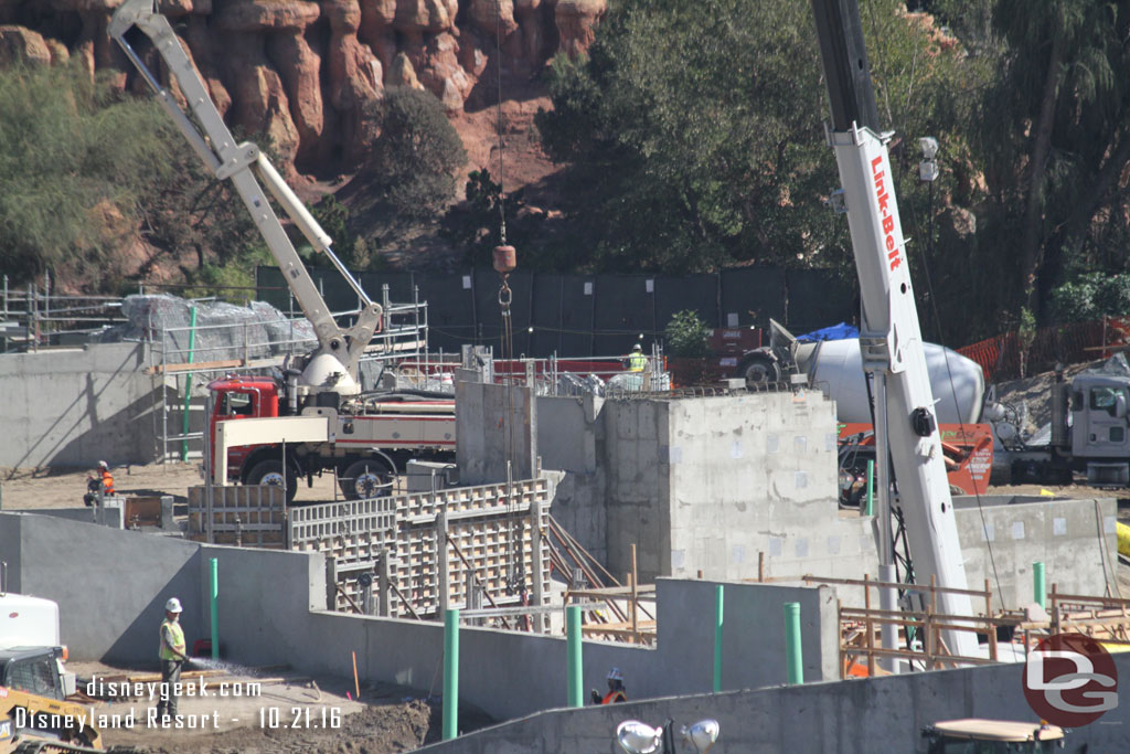 In the distance you can see wire mesh with scaffolding for rockwork (beyond the concrete pumping truck).