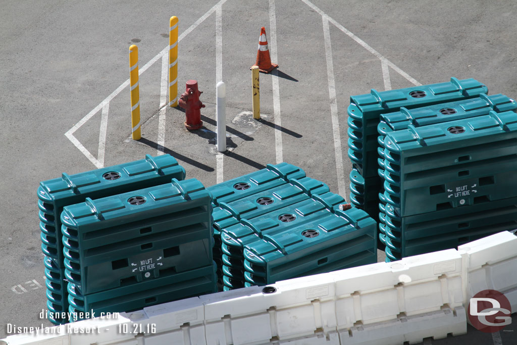 Temporary barriers staged in the lot.