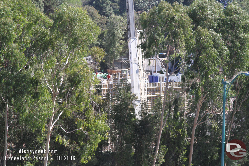 Through the trees you can see the new wall.