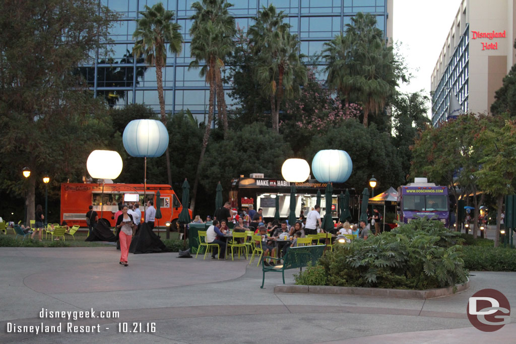 A seating area, lights and three trucks make up the event.