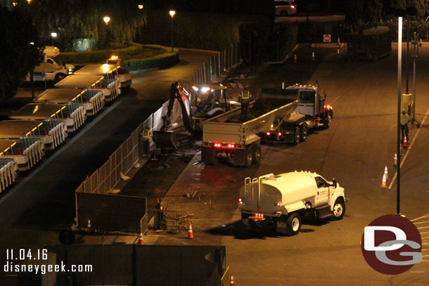 Another crew removing debris from the far side of the tram stop along the old walkway.