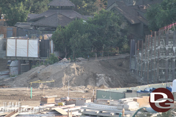 Where the train comes out from behind the Hungry Bear.  The new retaining wall on the right.