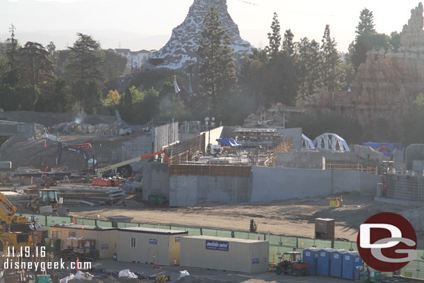 The backstage marina is slowly moving along. Notice the white trestle structure on the right, that marks where the Disneyland Railroad will cross over the walkway that leads in from Frontierland.