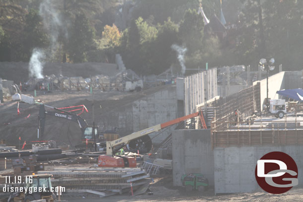 You can see the rock work wire mesh now sticking up above the dirt.  Assuming the smoke is from welders working on it this morning.