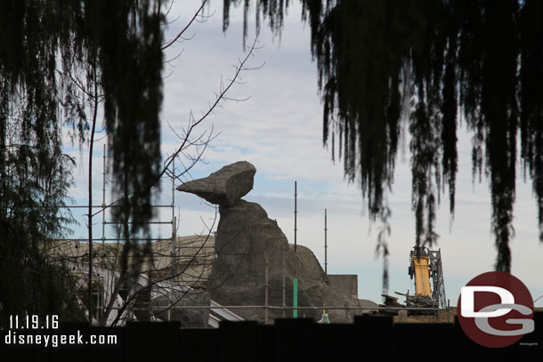 Scaffolding is down from the rock formation.