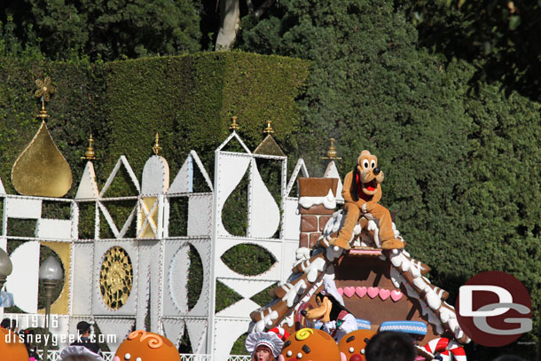 Pluto atop the gingerbread house.