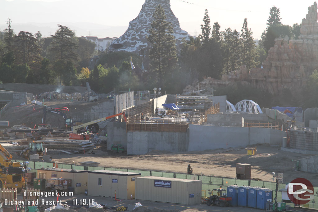 The backstage marina is slowly moving along. Notice the white trestle structure on the right, that marks where the Disneyland Railroad will cross over the walkway that leads in from Frontierland.