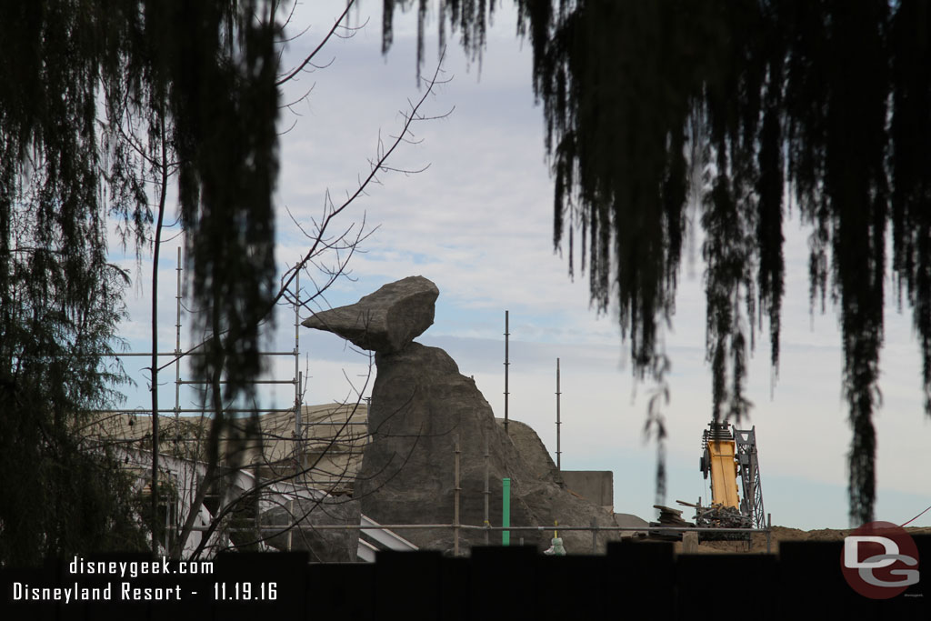 Scaffolding is down from the rock formation.