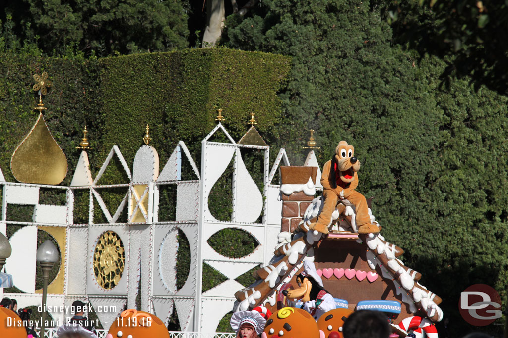 Pluto atop the gingerbread house.