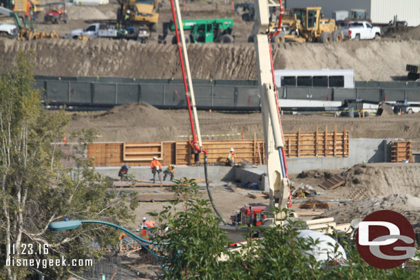 A closer look where they are pouring the concrete.