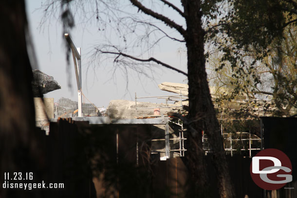 Some rock work visible over the fence.