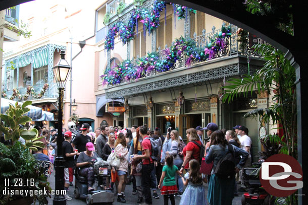 A crowd moving through New Orleans Square.