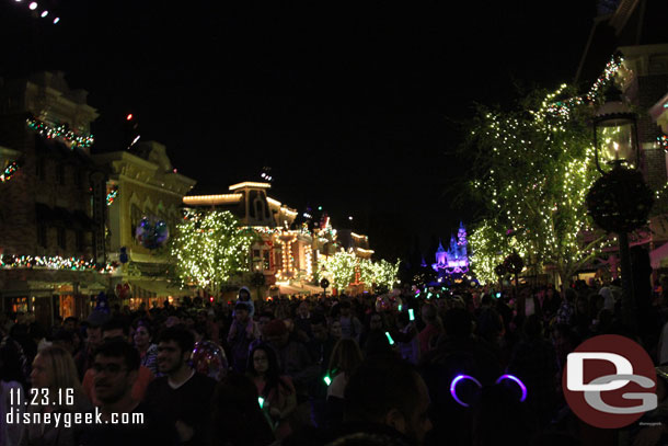 The green lights held by Cast Members marked my path up Main Street. It seemed a majority of guests along the parade route were exiting after the parade.