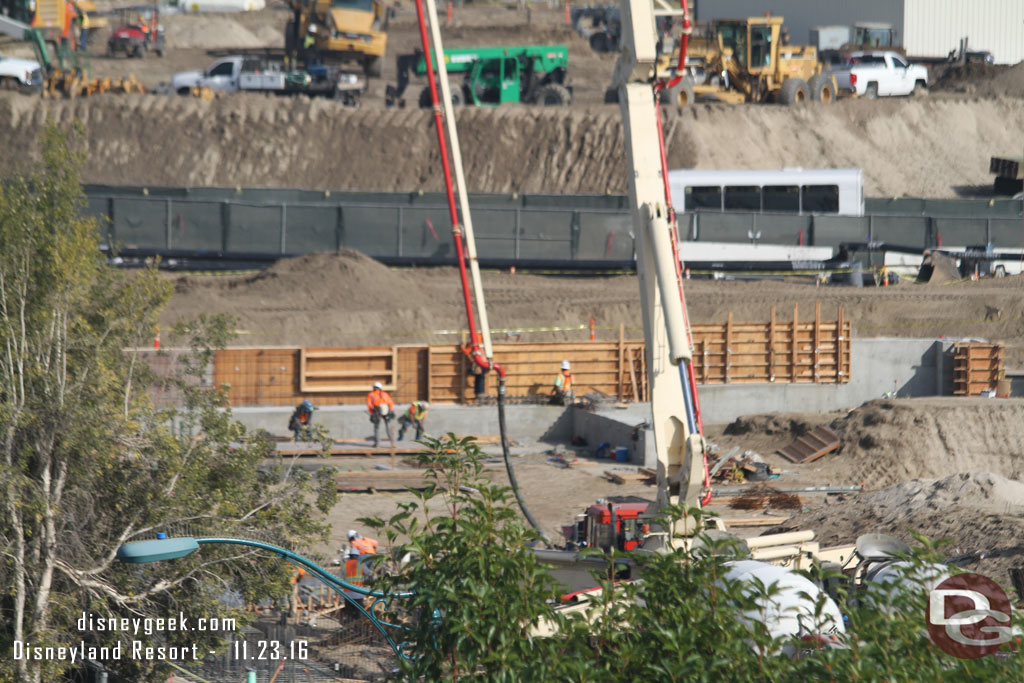 A closer look where they are pouring the concrete.