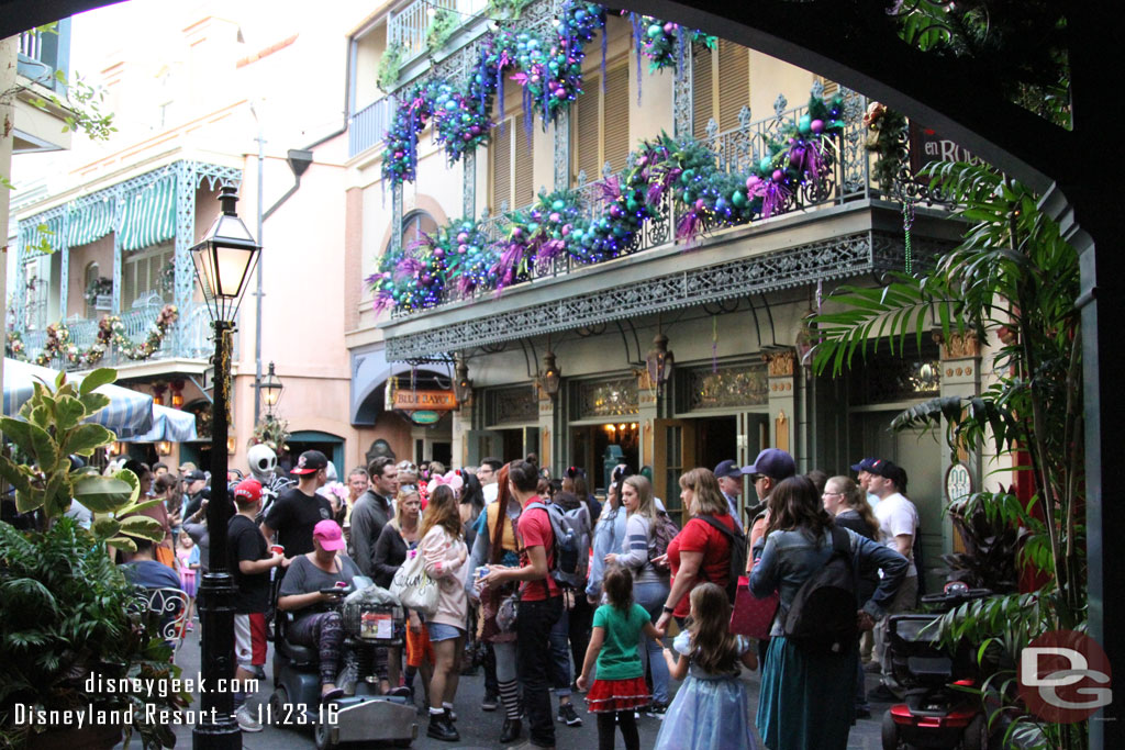 A crowd moving through New Orleans Square.