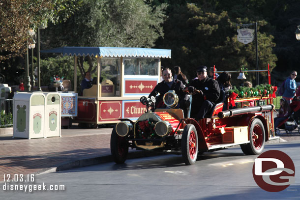 The fire truck pulling away from the curb to return to Town Square.