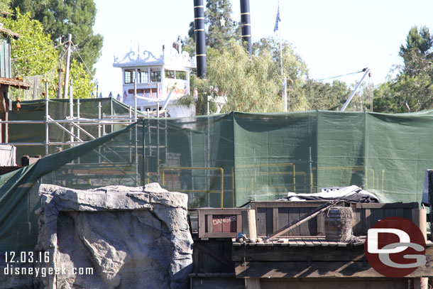 Safety fences visible through the mesh on the island.