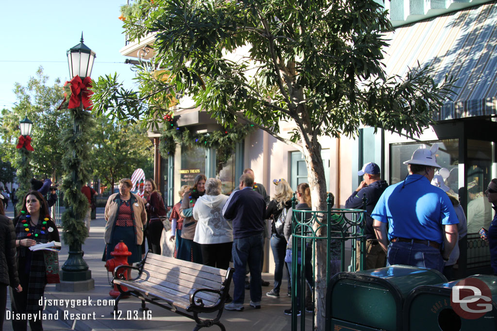 The front of the line had several cast members handing out the bands.