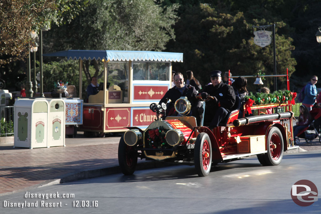 The fire truck pulling away from the curb to return to Town Square.