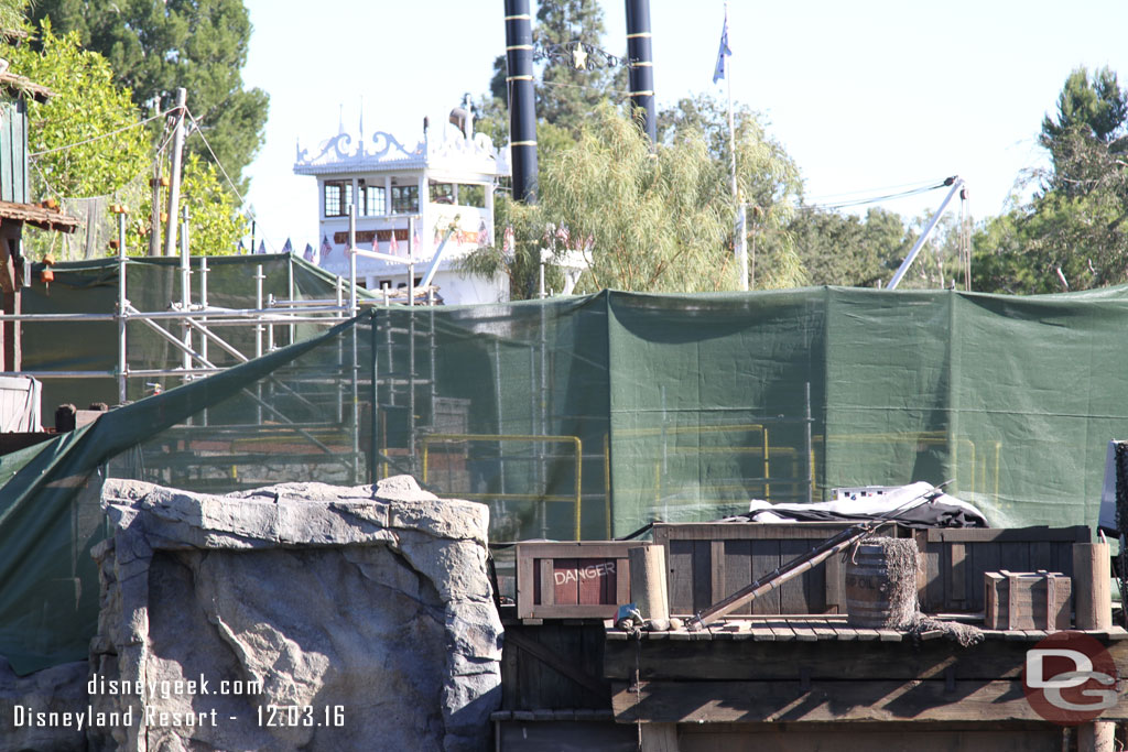 Safety fences visible through the mesh on the island.