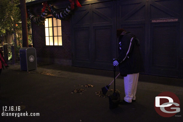 A cast member creating some leaf art on this cold and windy evening.