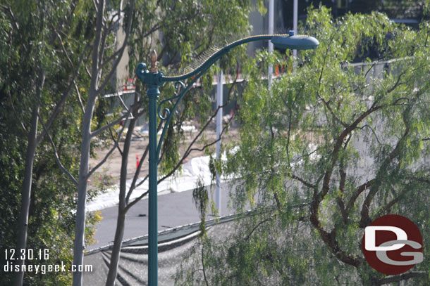 Looking to the right, behind Critter Country, parallel to the tram route you can see they have put a layer of Asphalt down for the backstage perimeter road.  Also looks like a parking lot off on the right through the trees.