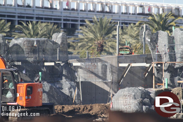 Wire mesh for the rock formations continues to be installed.