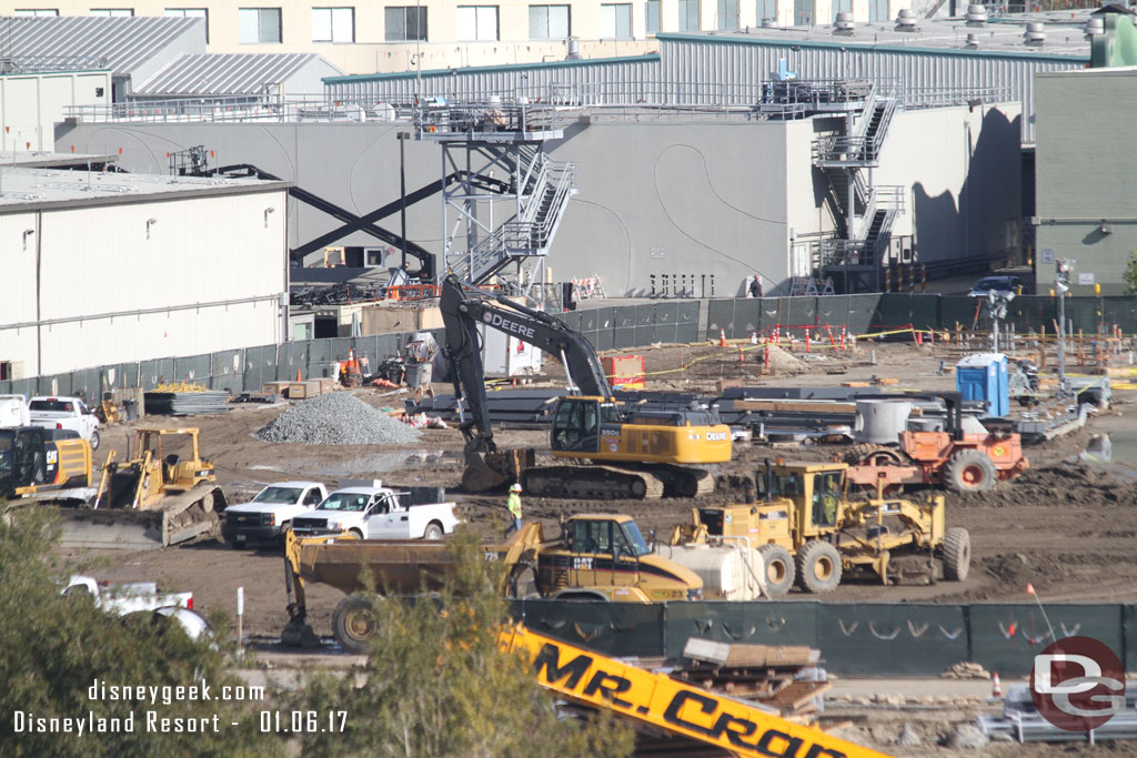 Some of the space is still a staging area, but beyond it looks like prep work, probably for another new backstage support building.