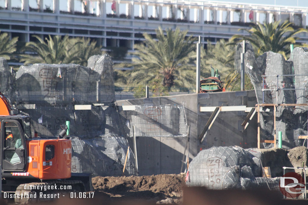 Wire mesh for the rock formations continues to be installed.