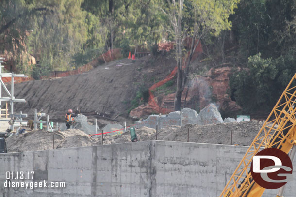 Crews assembling the wire mesh foundation for the rocks.  You could see smoke rising from the welders.