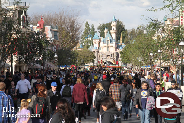 As always the street is alive with activity. Notice the snow has melted from Sleeping Beauty Castle.