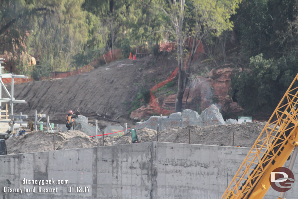 Crews assembling the wire mesh foundation for the rocks.  You could see smoke rising from the welders.