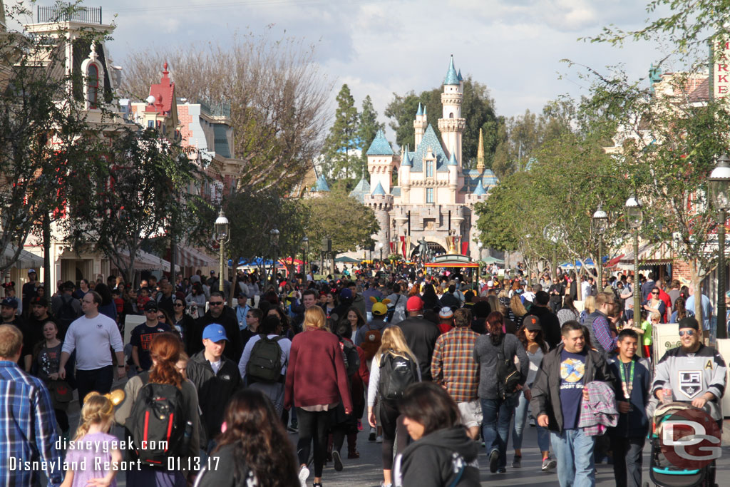 As always the street is alive with activity. Notice the snow has melted from Sleeping Beauty Castle.