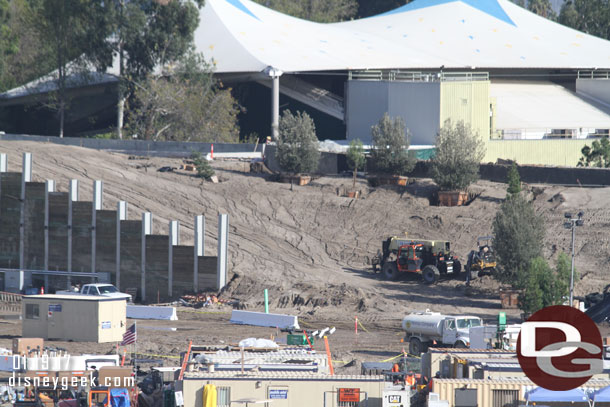 Trees are going in along the top of the berm between the train path and Star Wars.