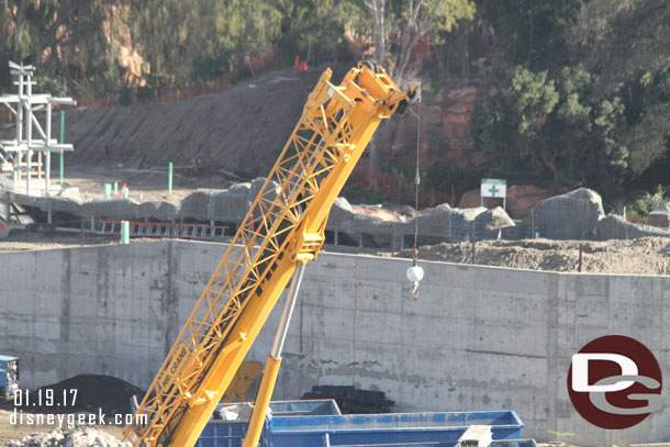 Looks like concrete has been applied to a good portion of the rock face along the Rivers of America