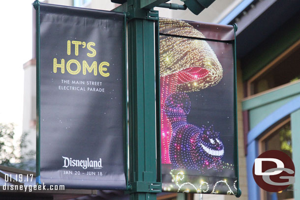 Main Street Electrical Parade banners line Downtown Disney.