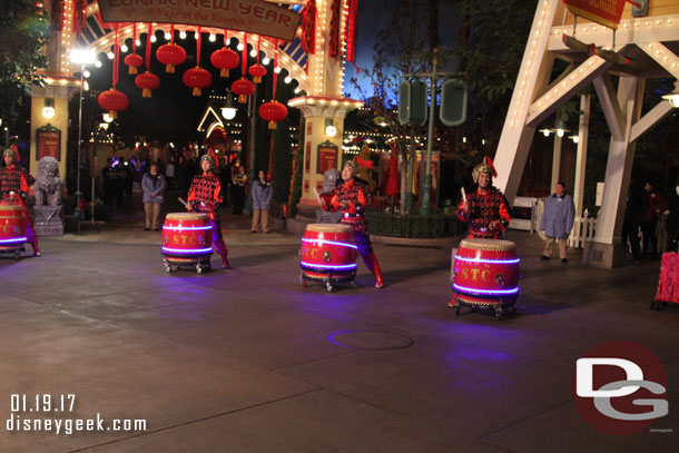 The procession heads down the parade route and only the drummers remain.