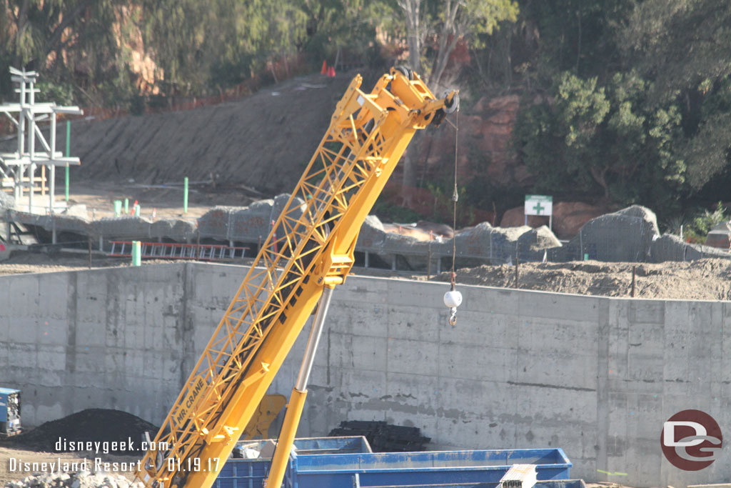 Looks like concrete has been applied to a good portion of the rock face along the Rivers of America