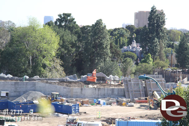 Crews were filling in and compacting dirt on the new berm between the Rivers of America and the Star Wars area.