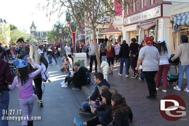 It is 3pm and guests are claiming curb seats for the Main Street Electrical Parade.. which starts at 8:30pm.  There are no day time parades going on right now.