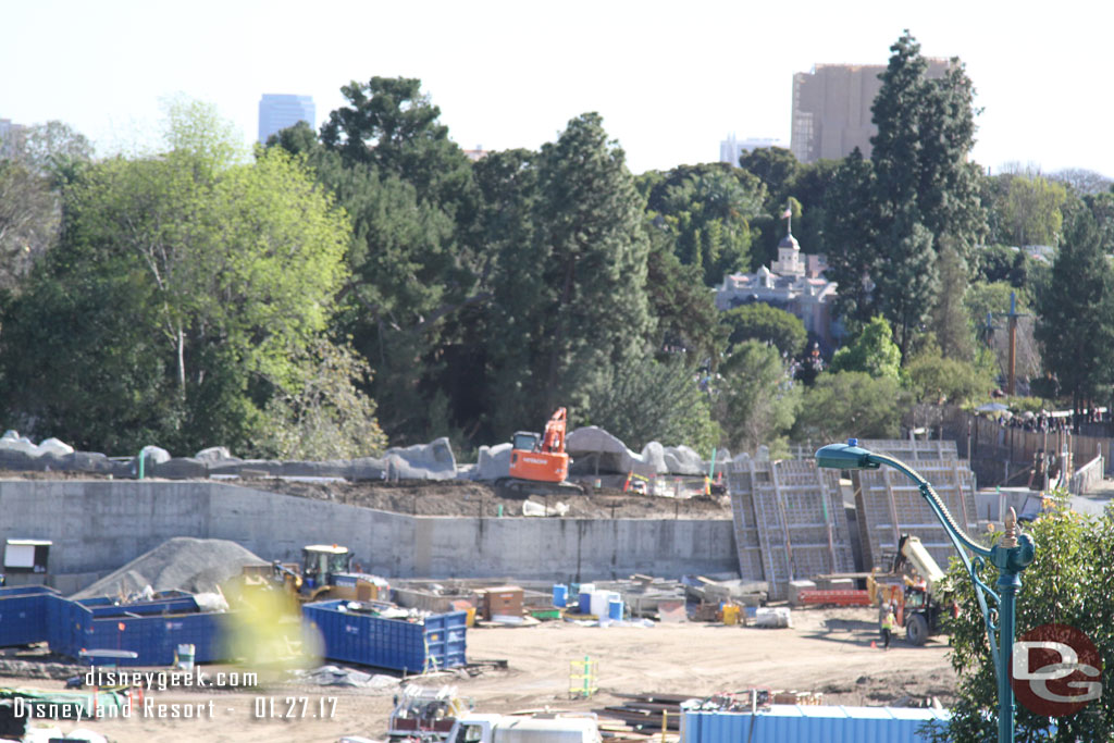 Crews were filling in and compacting dirt on the new berm between the Rivers of America and the Star Wars area.