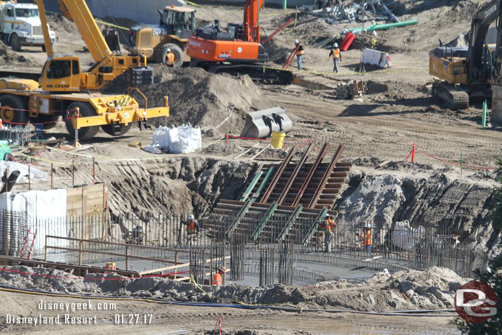 In the near lot concrete has been poured for the foundation in the hole on the far right of the new show building area.